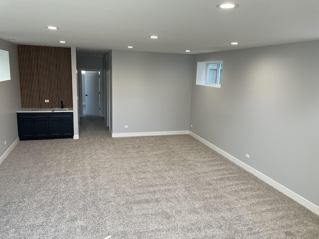 below grade area featuring recessed lighting and baseboards