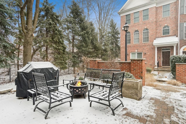 view of patio featuring fence and an outdoor fire pit