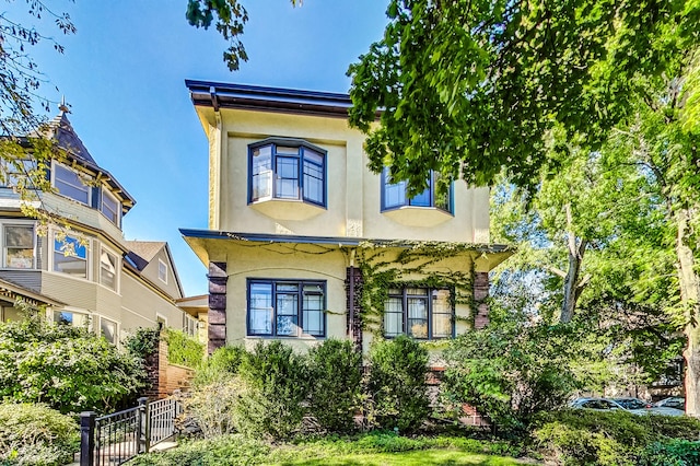 view of front of house featuring stucco siding