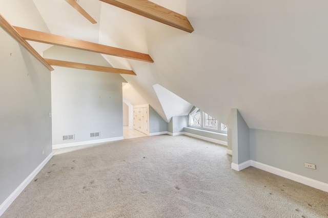 additional living space featuring lofted ceiling with beams, baseboards, and carpet flooring