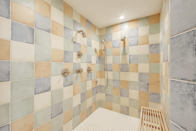 full bath with a tile shower