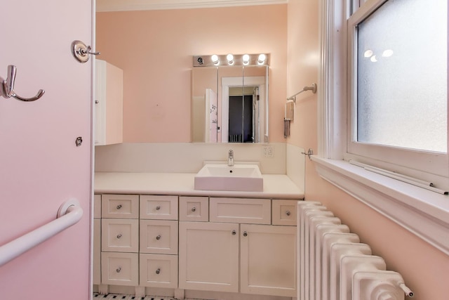 bathroom with vanity and radiator heating unit