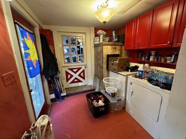 clothes washing area with washer and clothes dryer