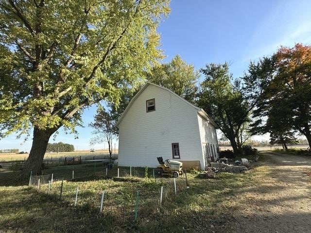 view of property exterior with fence