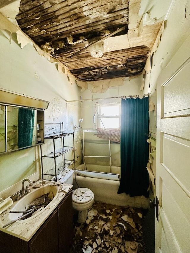 full bath featuring vanity, toilet, and washtub / shower combination