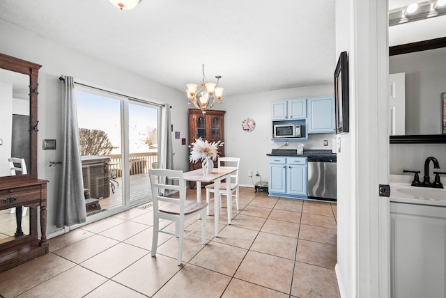 dining space featuring light tile patterned floors and a notable chandelier