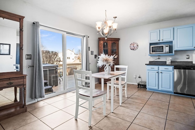 dining space featuring light tile patterned floors, baseboards, and an inviting chandelier