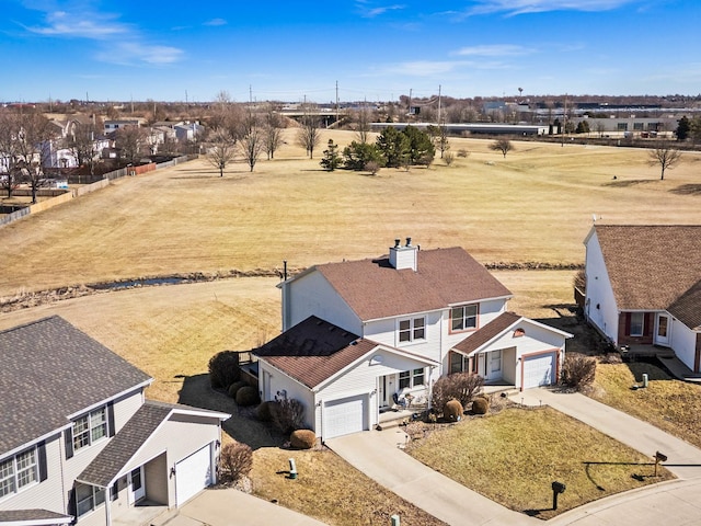 birds eye view of property with a rural view