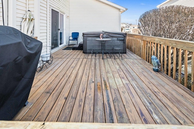 wooden terrace with a grill