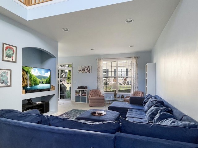 living room featuring recessed lighting and light colored carpet