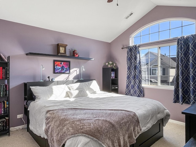 bedroom with vaulted ceiling, carpet, baseboards, and visible vents