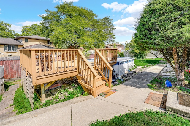 wooden terrace featuring a covered pool