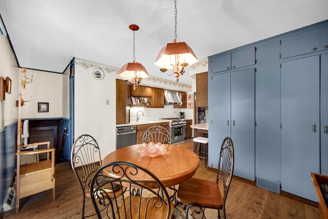 dining space with wood finished floors