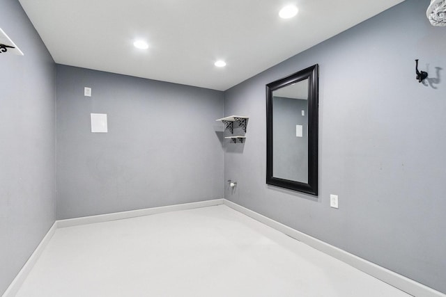 empty room with recessed lighting and baseboards