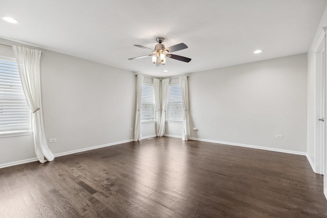 unfurnished room with dark wood-type flooring, recessed lighting, a ceiling fan, and baseboards