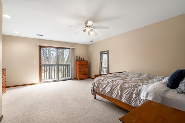 bedroom with visible vents, multiple windows, light colored carpet, and access to exterior