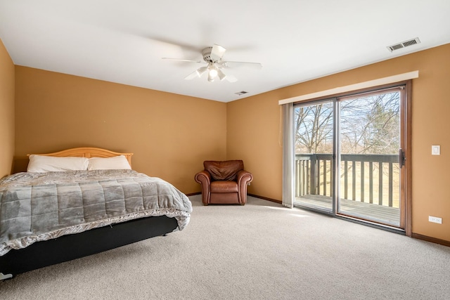 carpeted bedroom featuring ceiling fan, visible vents, baseboards, and access to exterior