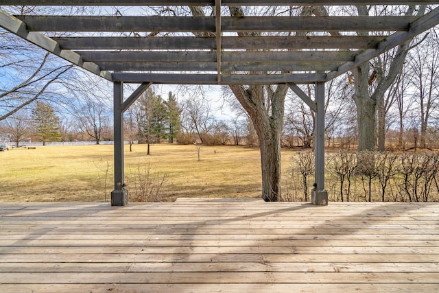 wooden terrace featuring a yard