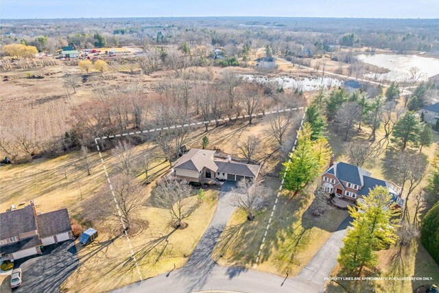 birds eye view of property featuring a rural view