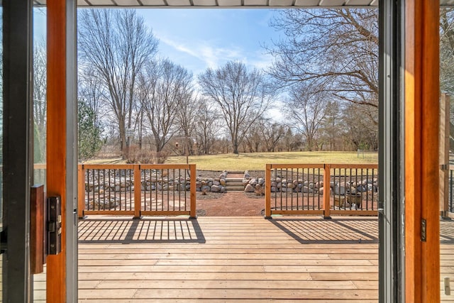 deck featuring a lawn