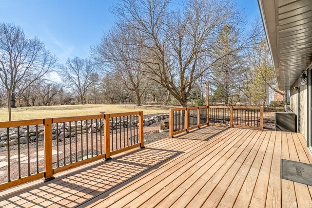 wooden terrace with a yard