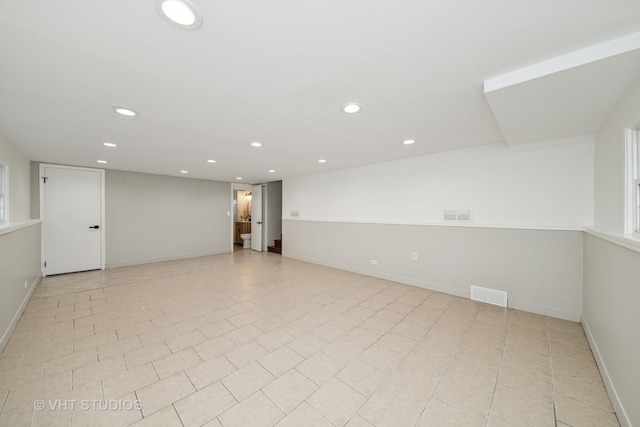 unfurnished room featuring light tile patterned flooring, recessed lighting, visible vents, and baseboards