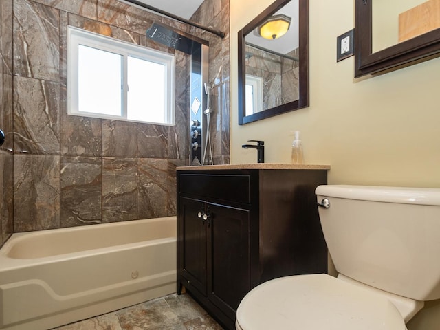 bathroom featuring bathtub / shower combination, toilet, and vanity