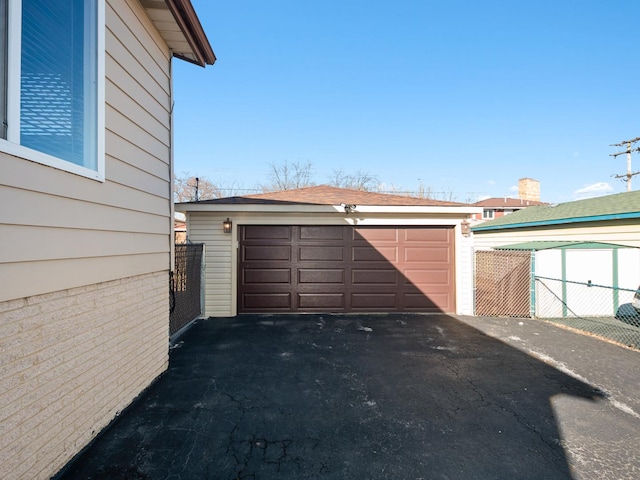 detached garage with fence