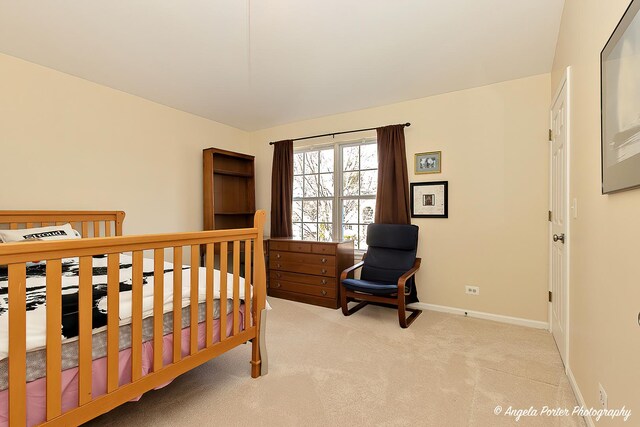 bedroom with carpet flooring and baseboards