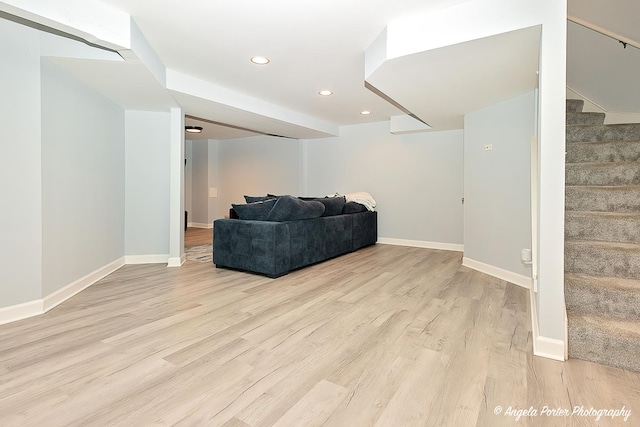 living room with stairway, recessed lighting, light wood-type flooring, and baseboards