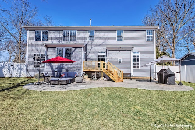 back of house featuring an outdoor hangout area, a lawn, a fenced backyard, and a patio area