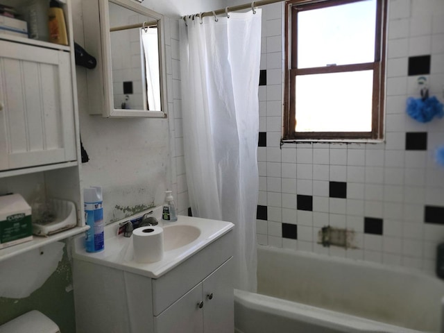 full bathroom with toilet, vanity, and shower / bath combo with shower curtain