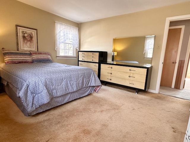 bedroom with light carpet