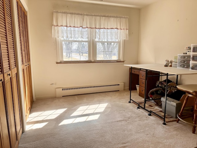 interior space featuring light carpet and baseboard heating