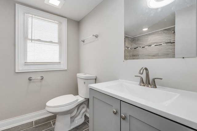 12533 S Lowe Ave, Chicago, IL 60628 - full bath featuring toilet, vanity, baseboards, and wood finished floors
