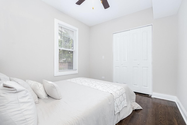 12533 S Lowe Ave, Chicago, IL 60628 - bedroom with baseboards, dark wood-style flooring, a closet, and ceiling fan