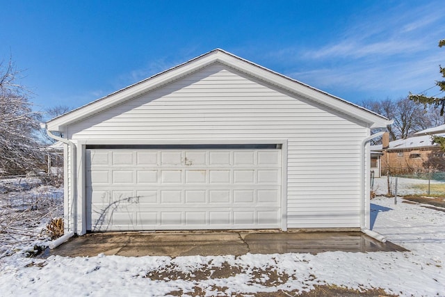 12533 S Lowe Ave, Chicago, IL 60628 - snow covered garage featuring a garage