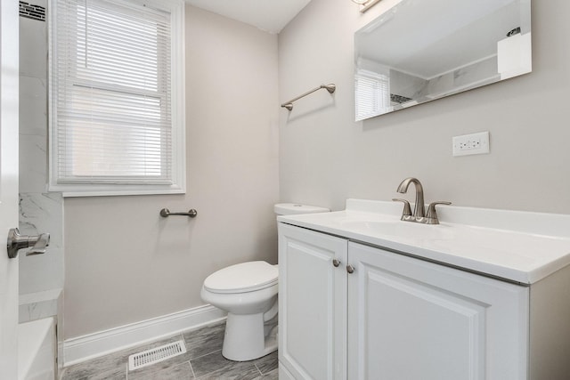 12533 S Lowe Ave, Chicago, IL 60628 - full bathroom with vanity, toilet, baseboards, and plenty of natural light