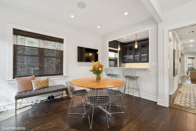 dining area with recessed lighting, baseboards, and wood finished floors