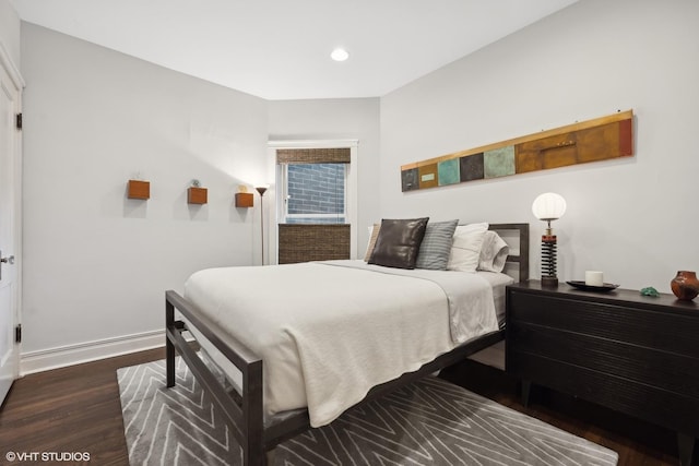 bedroom with recessed lighting, baseboards, and dark wood-style flooring