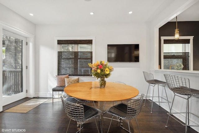 dining area with recessed lighting, baseboards, and wood finished floors