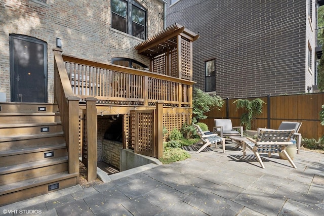 view of patio featuring stairway and a deck