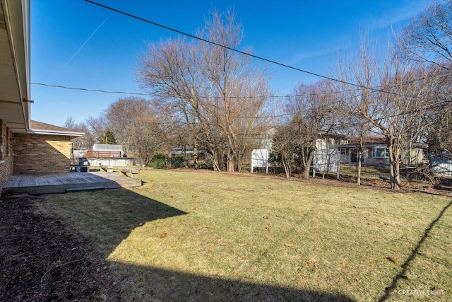 view of yard with a deck