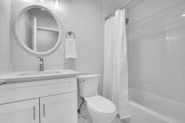 bathroom with marble finish floor, vanity, toilet, and shower / bath combo with shower curtain