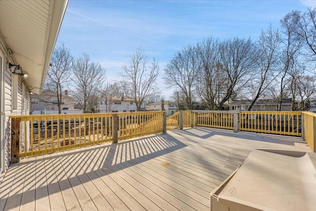 wooden deck with a residential view