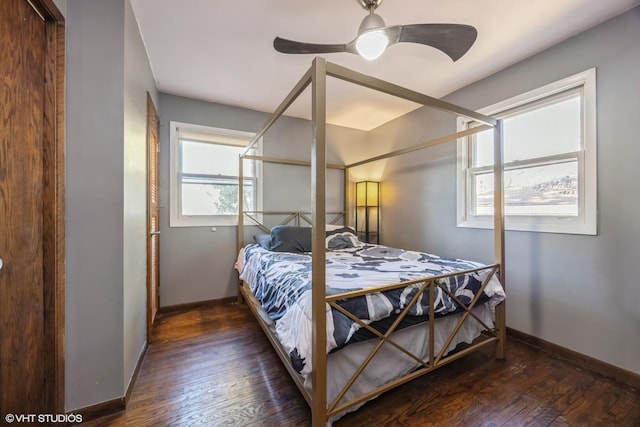 bedroom with baseboards, ceiling fan, and hardwood / wood-style flooring