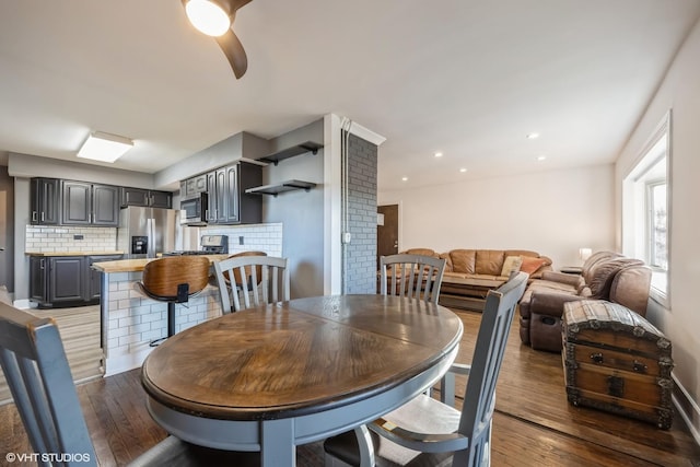 dining room with recessed lighting, ceiling fan, and wood-type flooring