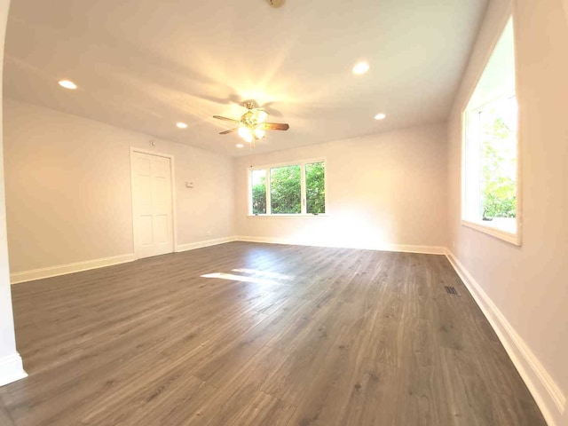 unfurnished room featuring visible vents, a ceiling fan, dark wood-style floors, recessed lighting, and baseboards