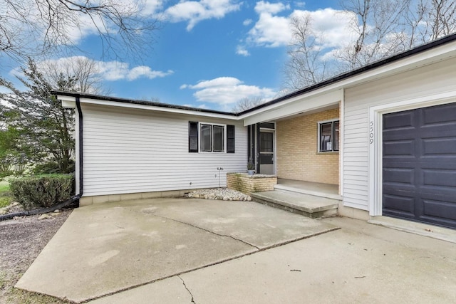 entrance to property with an attached garage