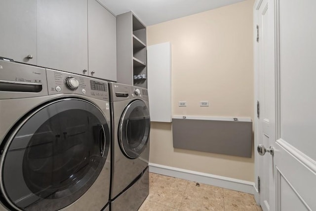 219 E Lake Shore Dr Unit 2Abc, Chicago, IL 60611 - laundry room featuring independent washer and dryer, cabinet space, and baseboards